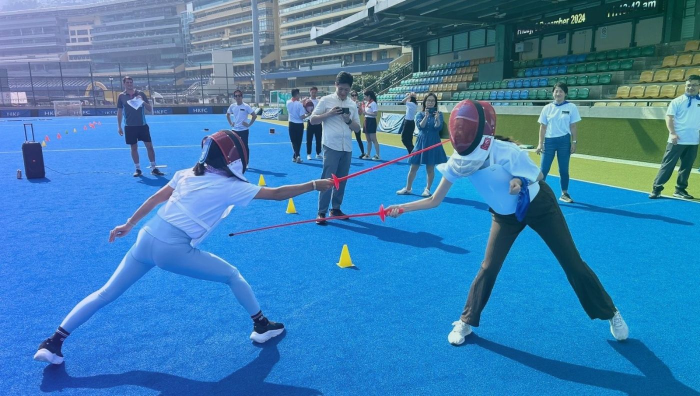 Participants wear lightweight protective gear and use lightweight plastic swords equipped with sensors that detect hits.